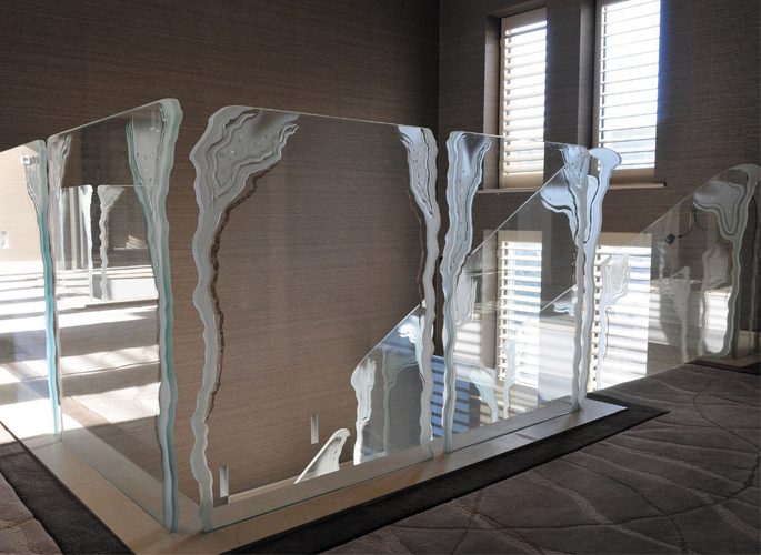 architectural glass staircase with floor to ceiling windows
