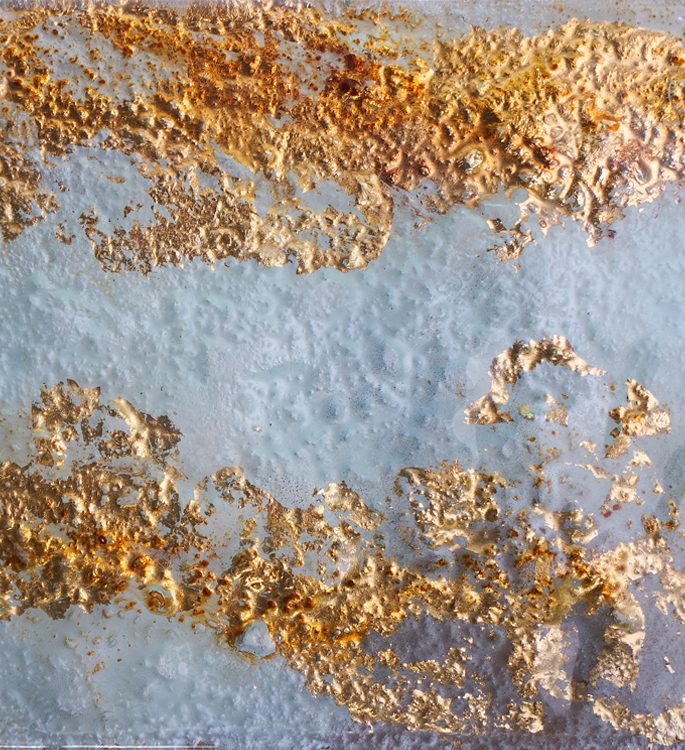 architectural glass panel with gold leaf pattern and a misty finish