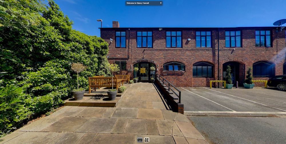 a screenshot from Glancy Fawcett's 360 VR tour showing the outside of the builidng