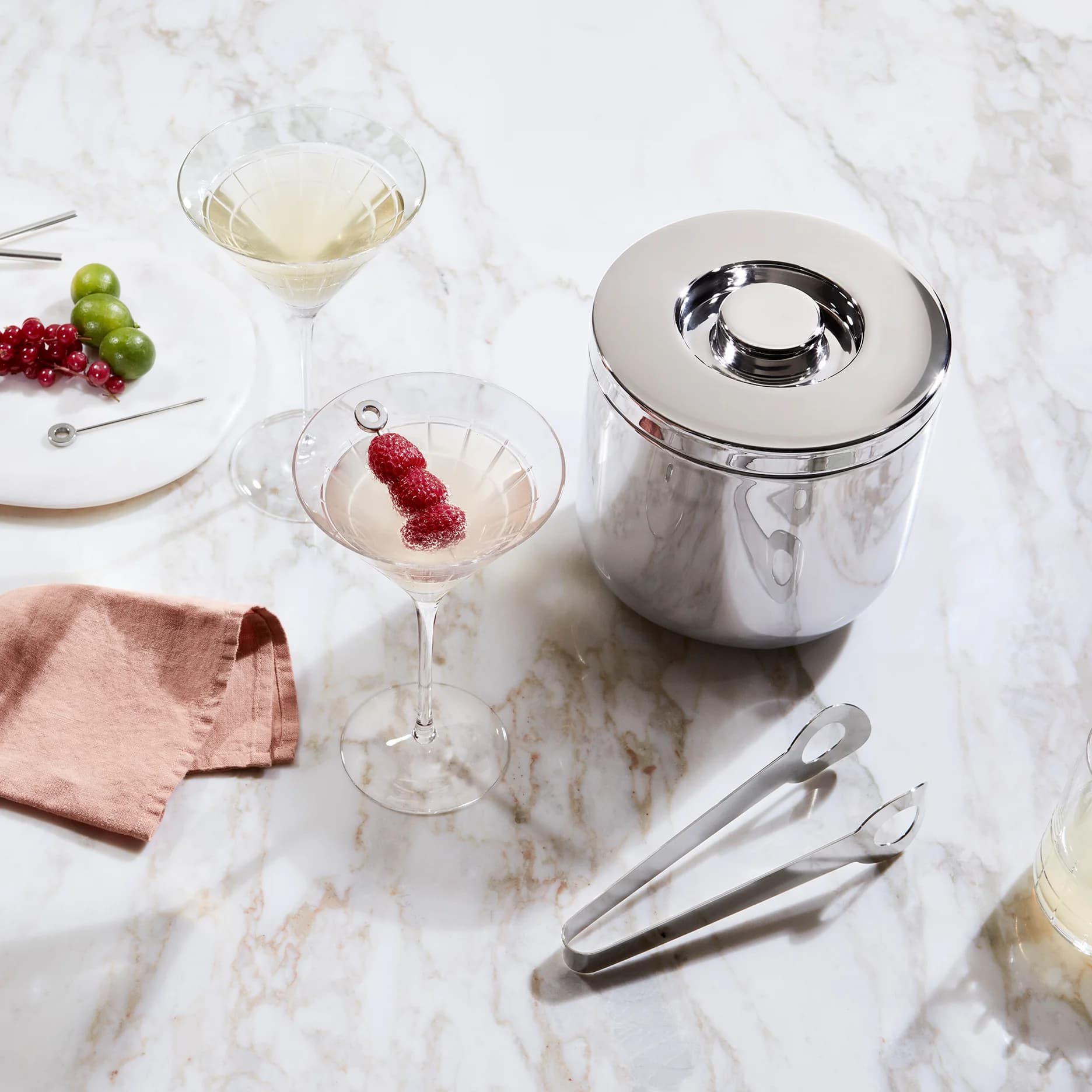 Christofle insulated ice bucket and tongs in stainless steel, paired with a Graphik Martini Glass