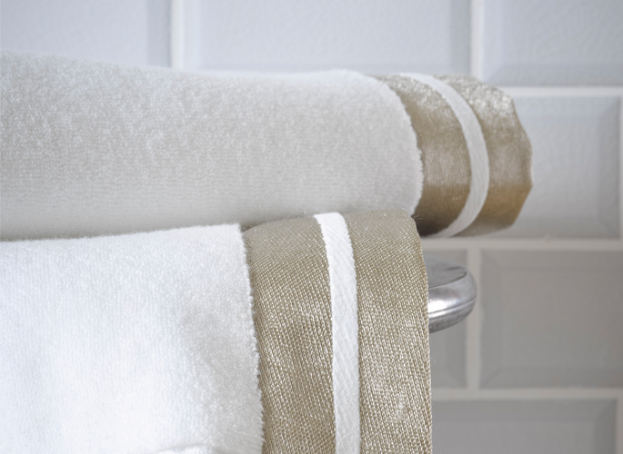 modern white luxury bathroom towels with two gold fabric borders