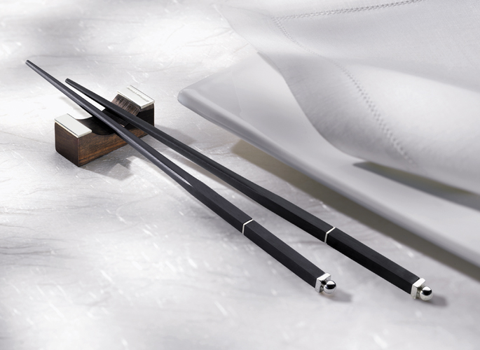 black chopsticks with a silver end and detailing 