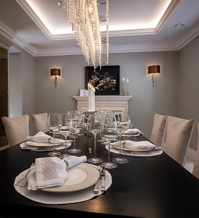 a dining room in a luxury house with beautiful tableware