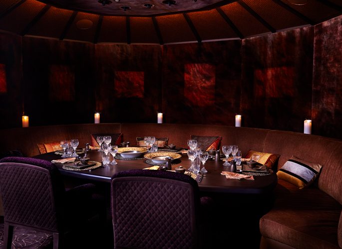 motor yacht aviva dining room, red decor with luxury tableware