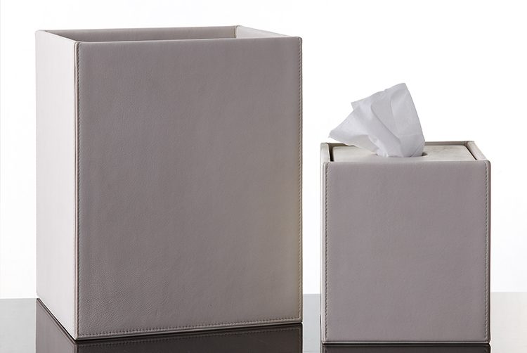 a white leather paper bin and tissue box