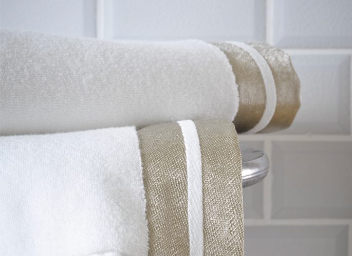modern white luxury bathroom towels with two gold fabric borders