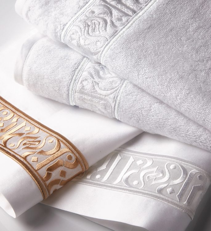 personalised towel with a middle eastern pattern in gold and silver embroidery
