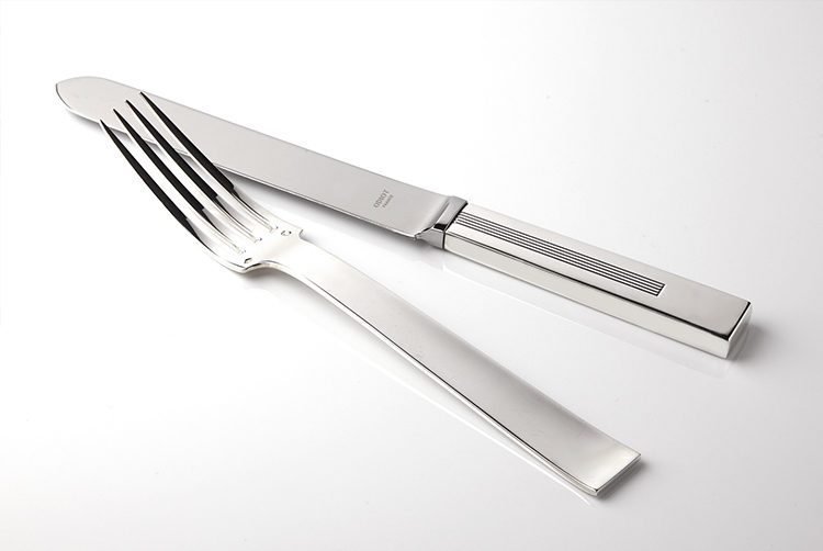 silver modern cutlery in detail with square handles