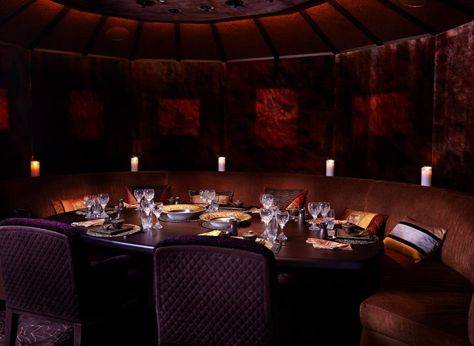 motor yacht aviva dining room, red decor with luxury tableware