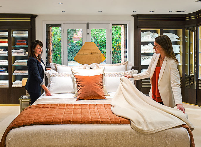 The Projects Team Showcasing luxury bed linen in the Glancy Fawcett Linen Room on the show bed