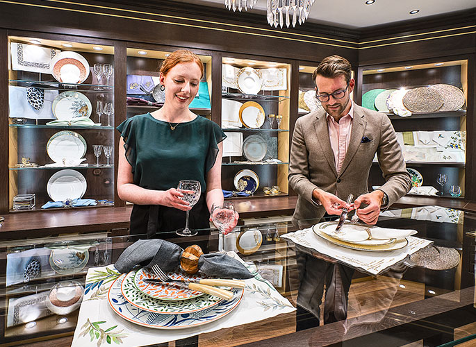 The Projects Team showcasing tableware settings to a client in the Glancy Fawcett Table Linen Showroom