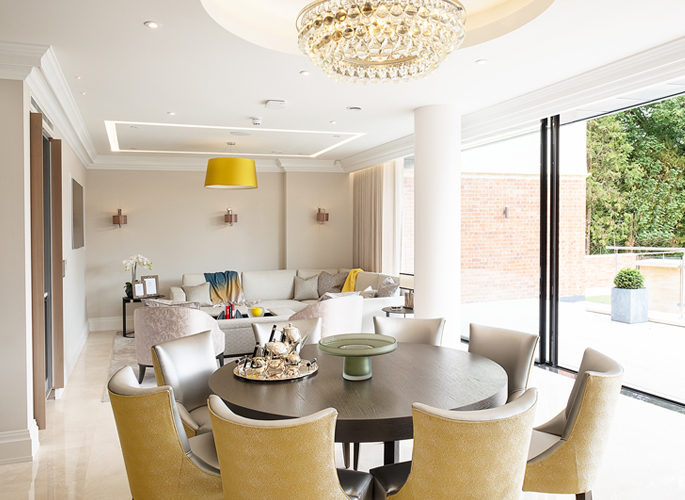 an open plan sitting room with luxury accessories and neutral decor
