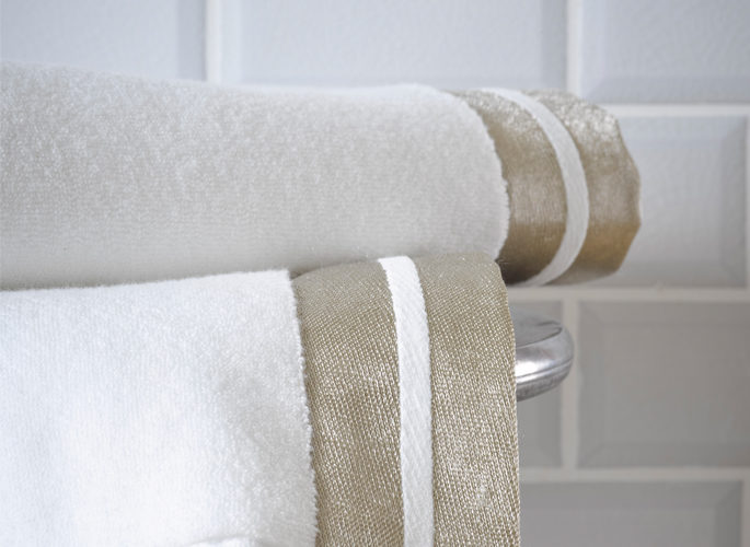 modern white luxury bathroom towels with  two gold fabric borders