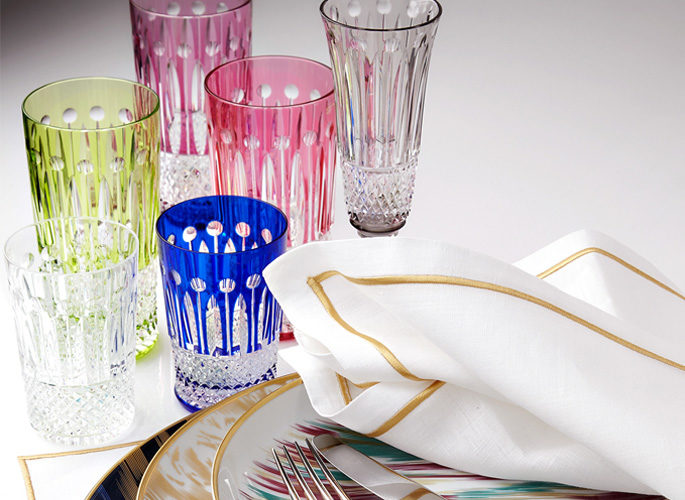 multi-coloured crystal glasses in green, blue and pink and purple