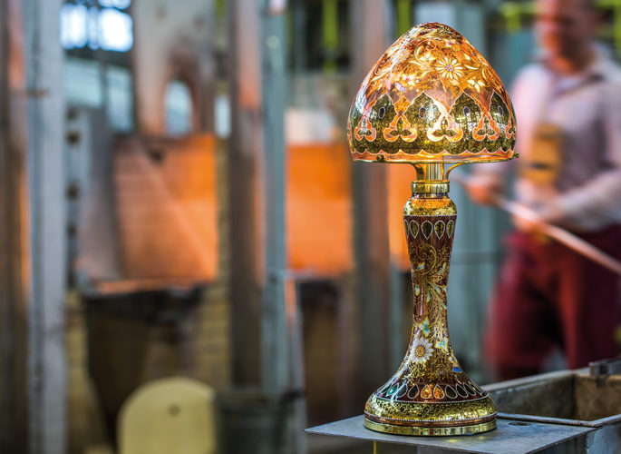 an artisan craftsman making crystal lamps from scratch in a kiln