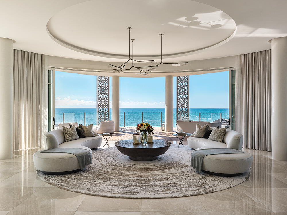 a reception room with a sea view and lots of luxury accessories